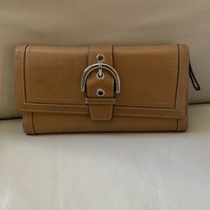 Coach buckle wallet. 💝 with minor interior water mark. Good cosmetic condition.